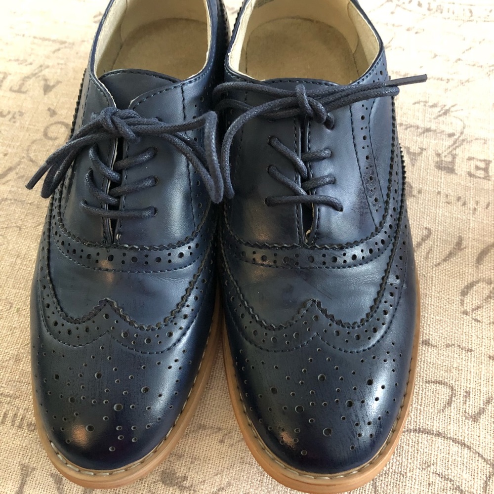 Navy blue wingtip shoes. Size 7